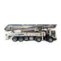 Pompe avec mât de distribution de marque schwing S 47 SX à louer